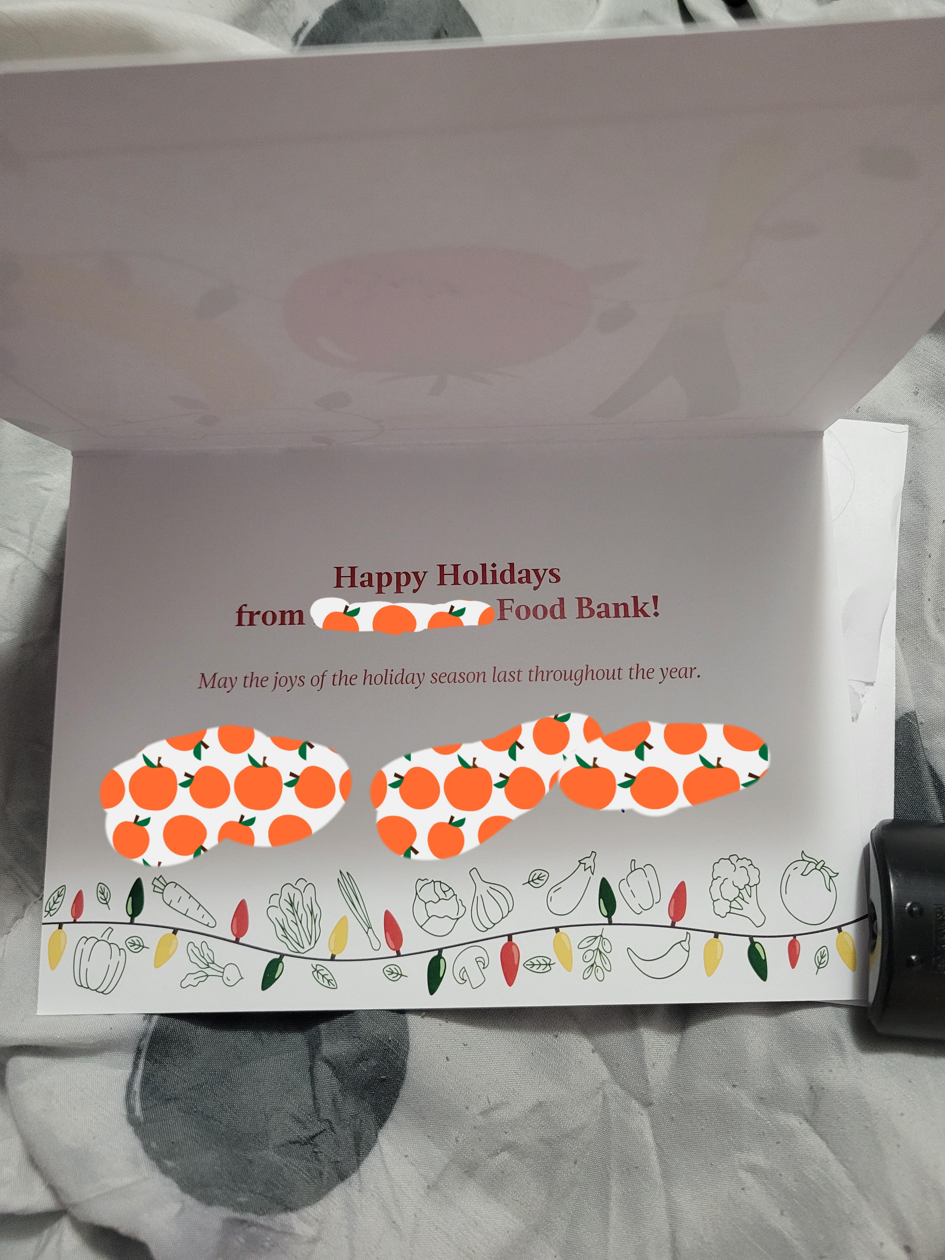 Christmas card from a food bank that reads happy holiday from the food bank and may the joys of the holiday season last throughout the year.